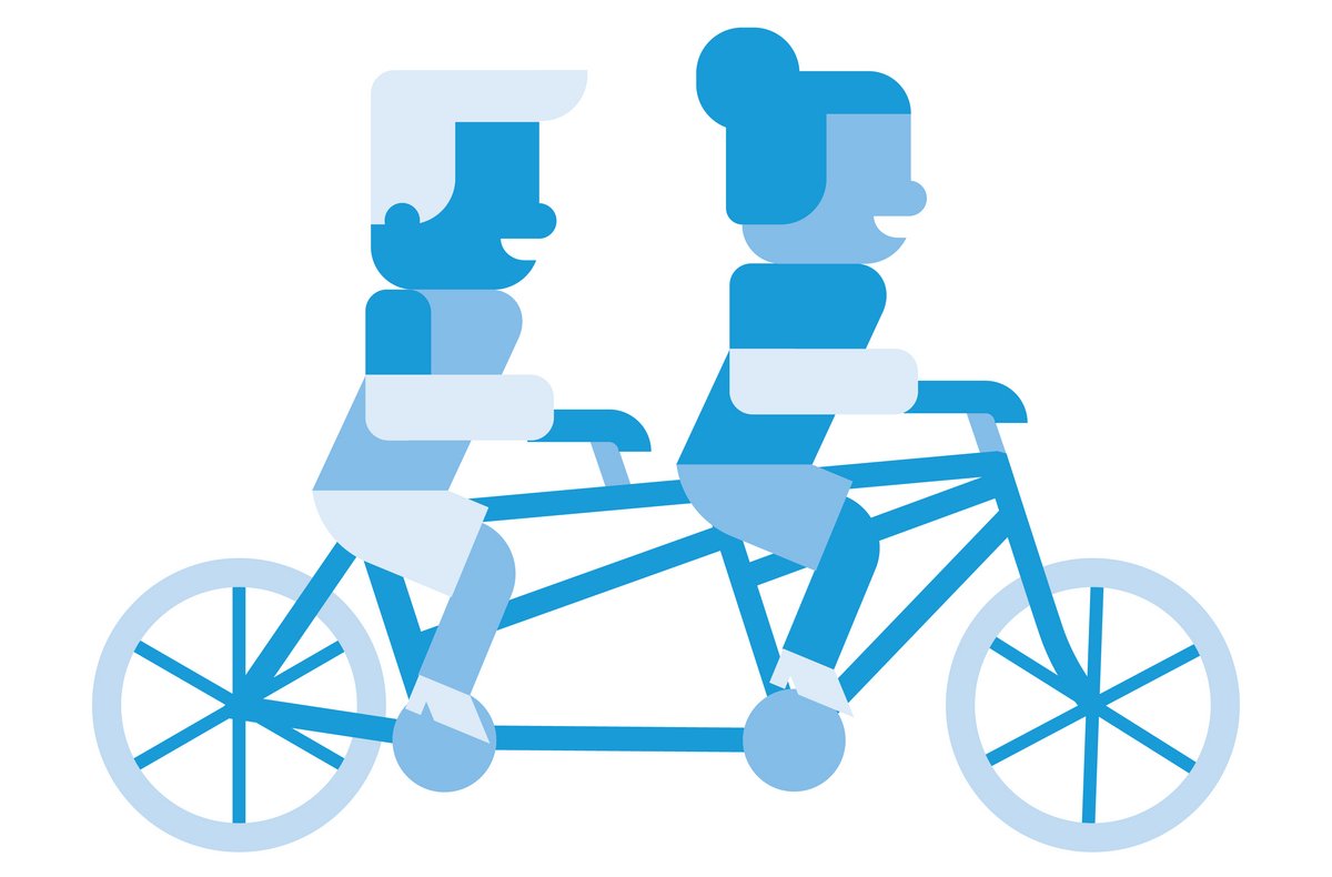 Two people riding a tandem bike